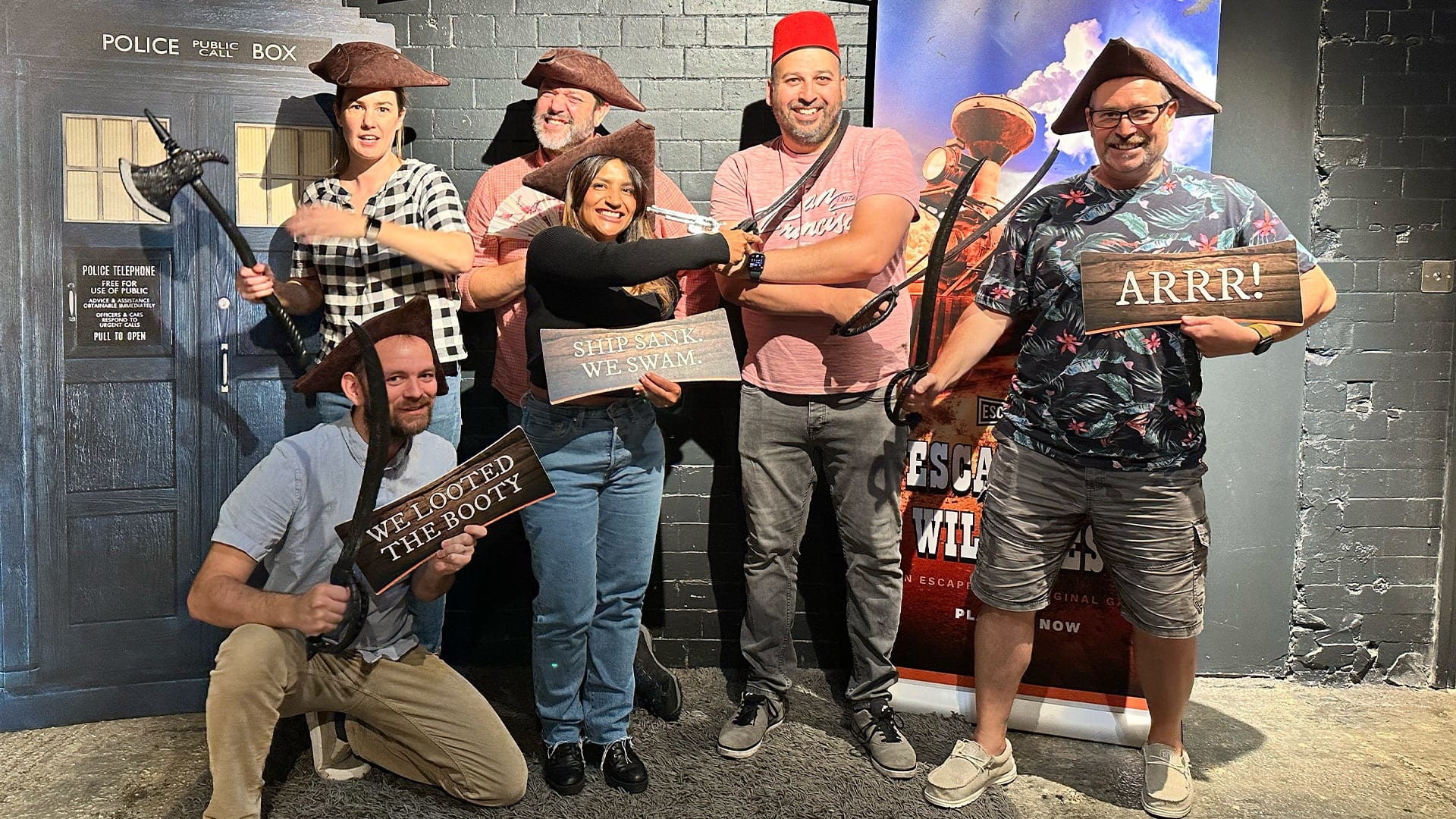 Group photo of the Rocket CRM team dressed up as pirates at an escape room.