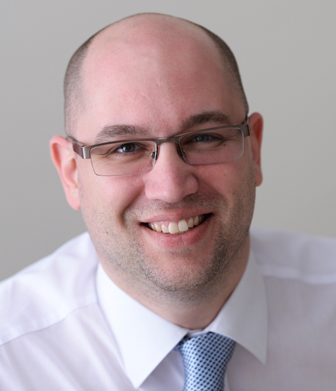 Portrait of Terry Hopper of App Insight, in a smart white shirt close-up.