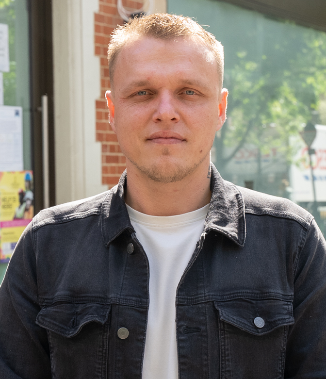 Portrait of Frank Fatura of Chefs with Care, in a grey denim jacket standing in London street.